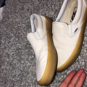 White Vans with gum-sole. Slip on.